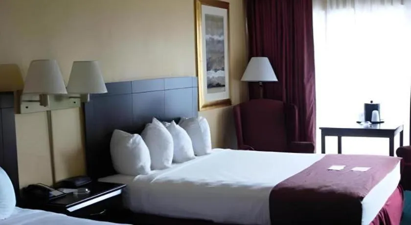 Bed in Magnuson Grand Conference Hotel