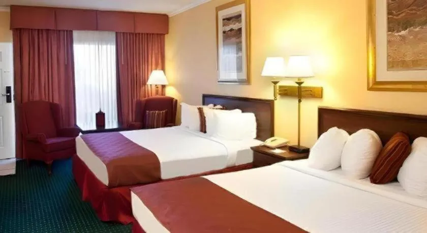 Bed in Magnuson Grand Conference Hotel