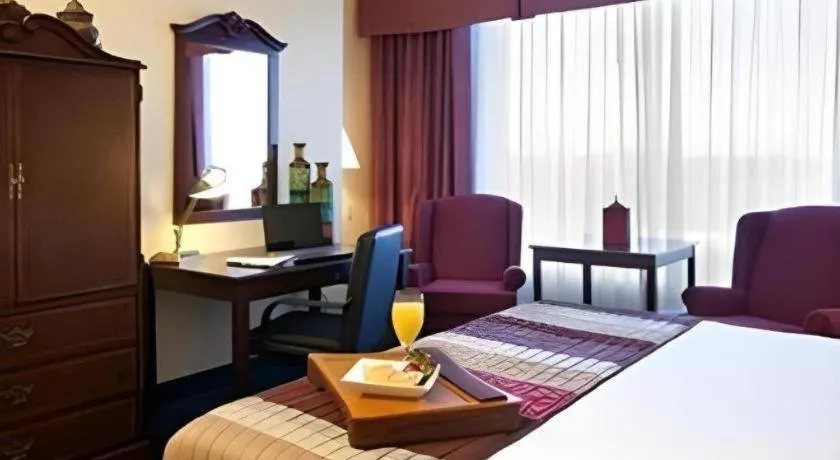 Bed in Magnuson Grand Conference Hotel