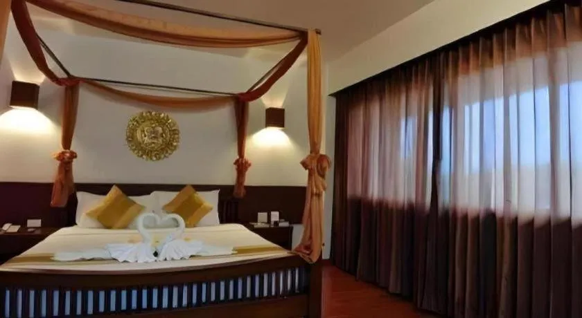 Bed in The Ligor City Hotel