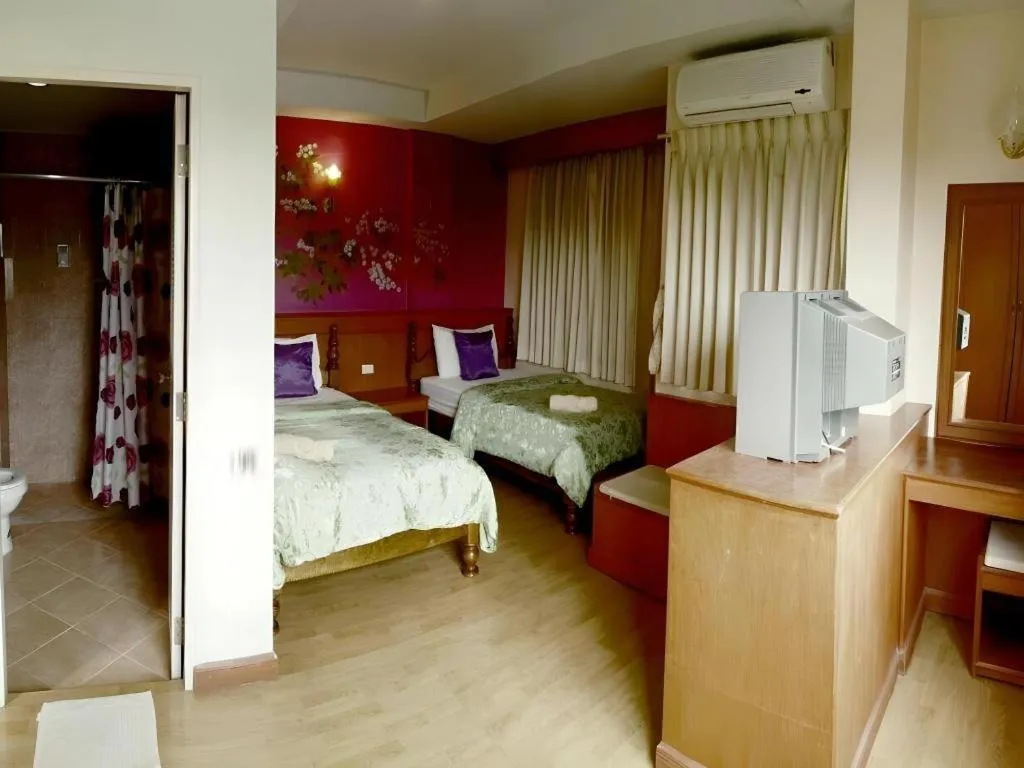 Bed in Loei Orchid Hotel