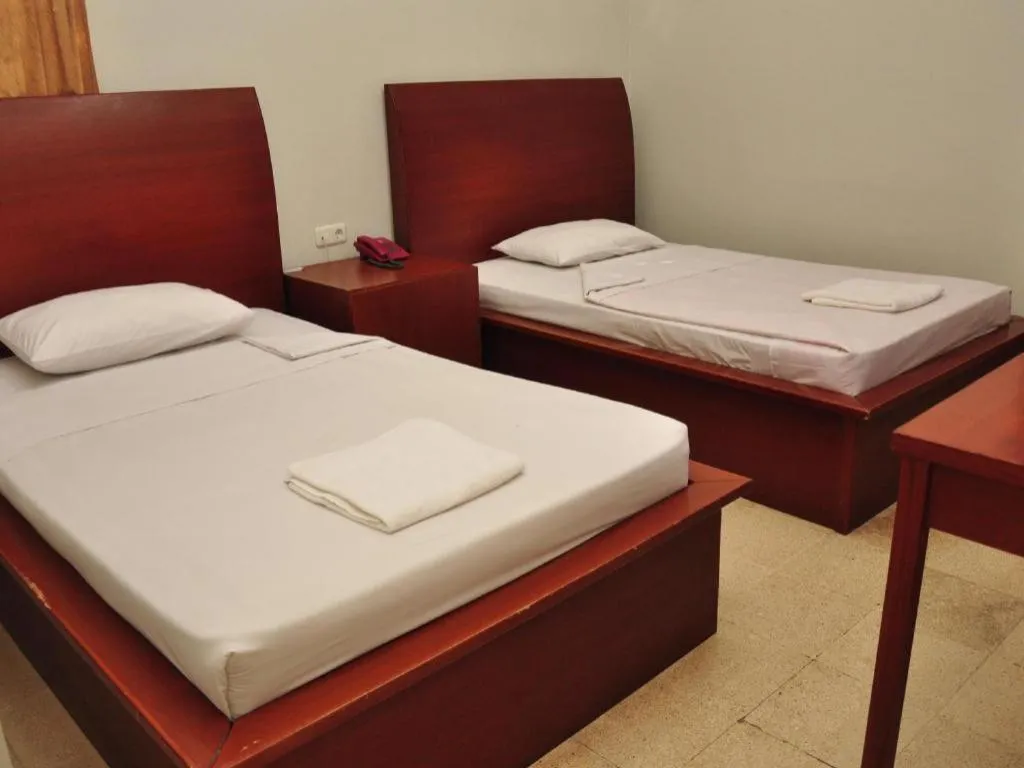 Bed in Hotel Minahasa