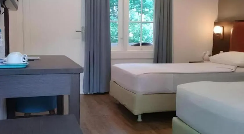 Bed in Hotel Minahasa