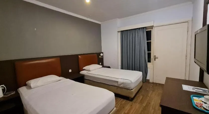 Bed in Hotel Minahasa