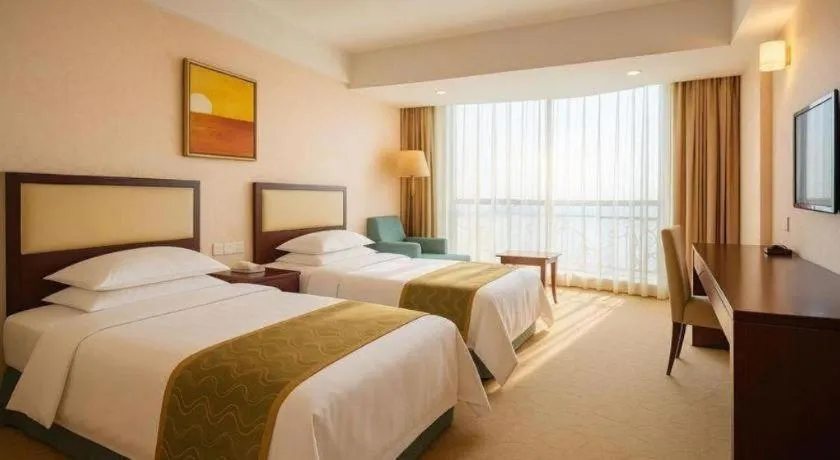 Bed in Wuhan Newport International Hotel