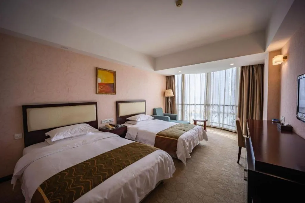 Bed in Wuhan Newport International Hotel