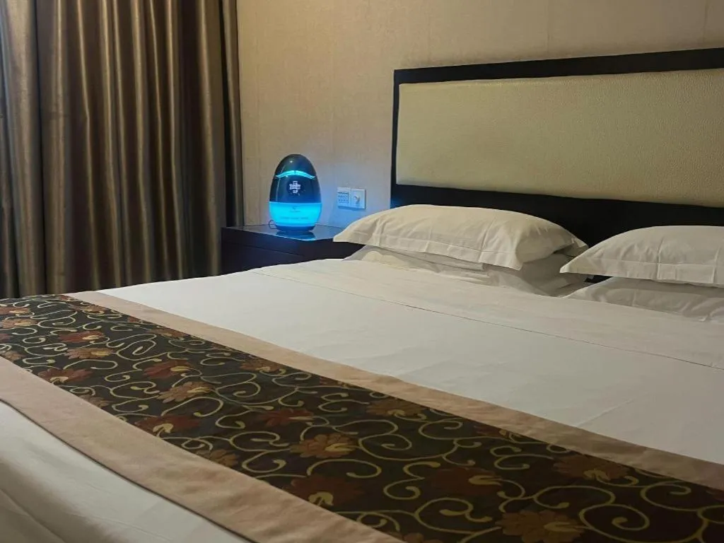 Bed in Wuhan Newport International Hotel