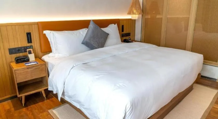 Bed in Dongguan Castfast Hotel