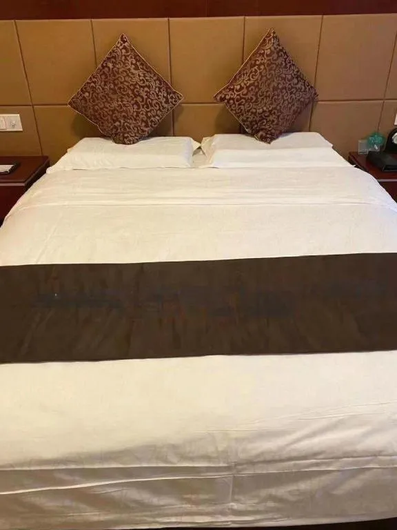Bed in Qingdao Chengyang Detai Hotel
