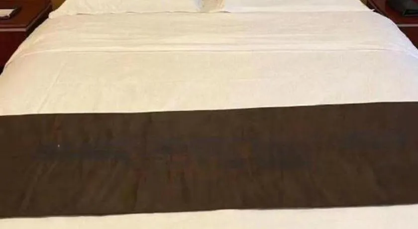 Bed in Qingdao Chengyang Detai Hotel