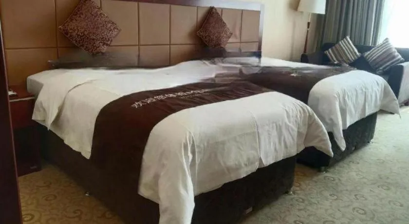 Bed in Qingdao Chengyang Detai Hotel