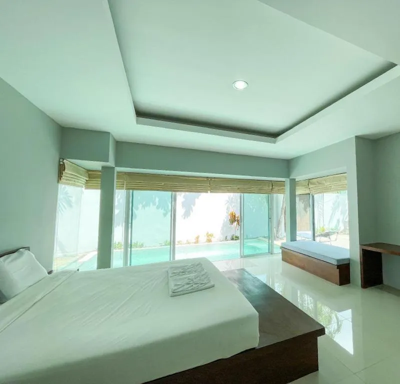 Bed in The Living Pool Villas