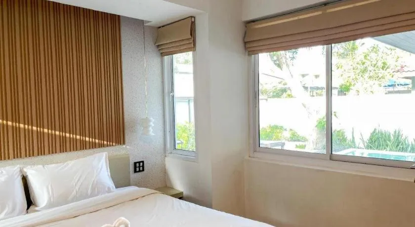 Bed in The Living Pool Villas