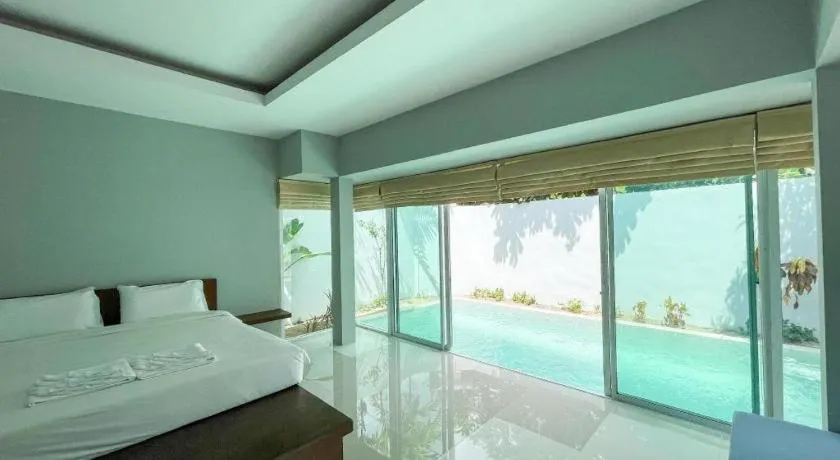Bed in The Living Pool Villas