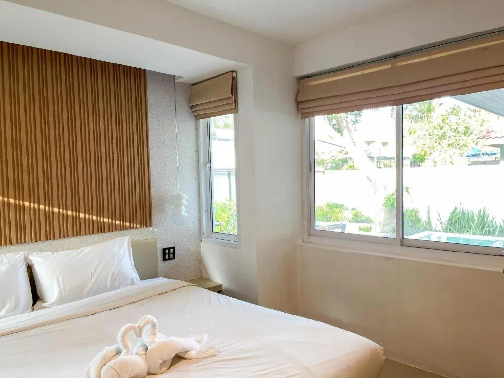 Bed in The Living Pool Villas