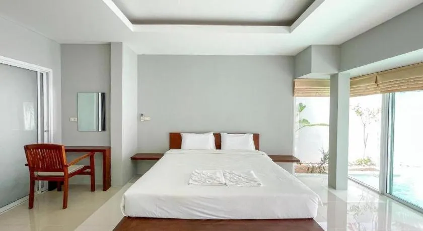 Bed in The Living Pool Villas