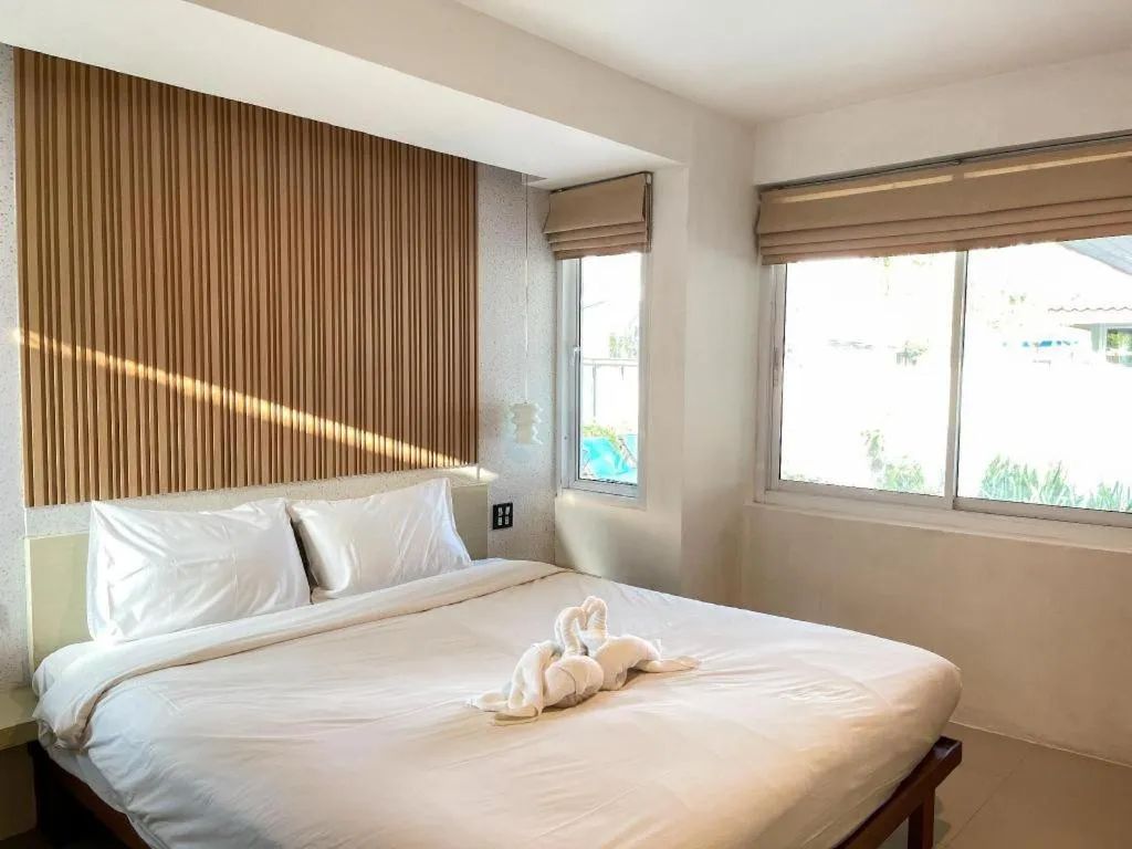 Bed in The Living Pool Villas