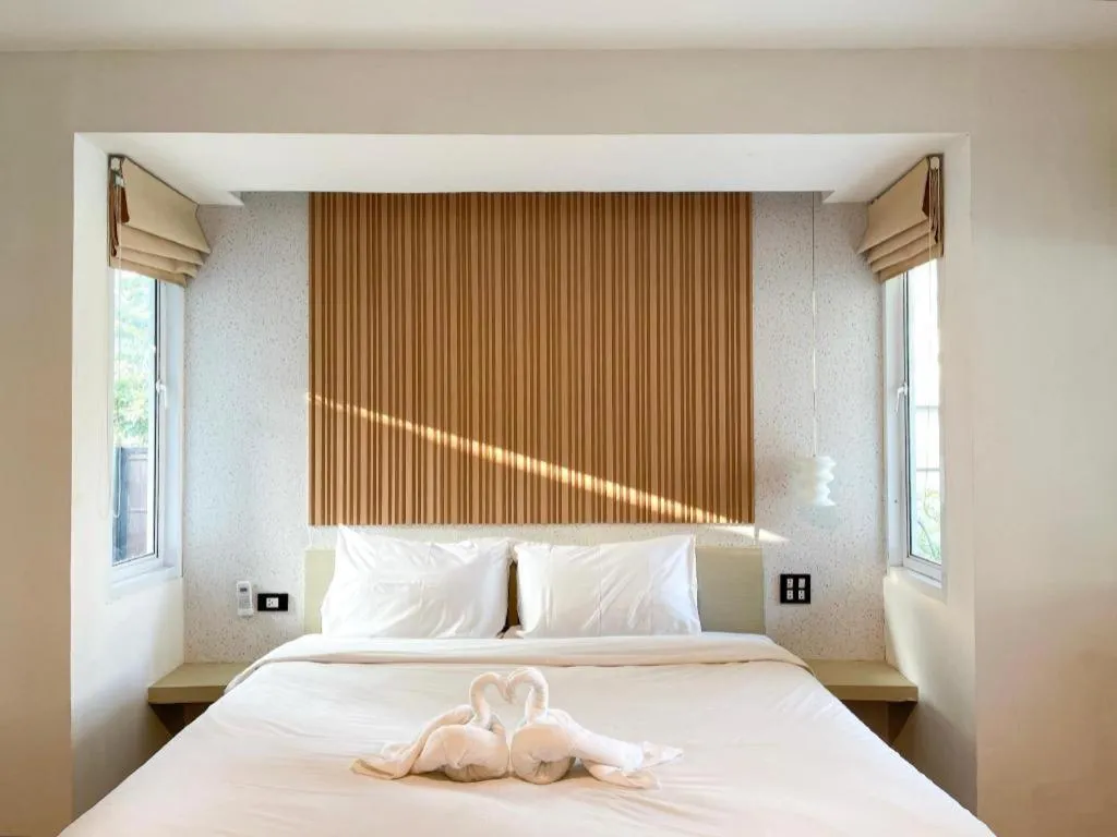 Bed in The Living Pool Villas