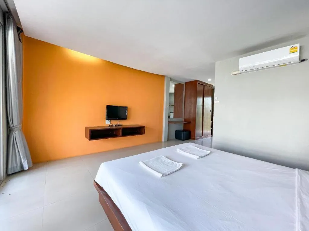 Bed in The Living Pool Villas