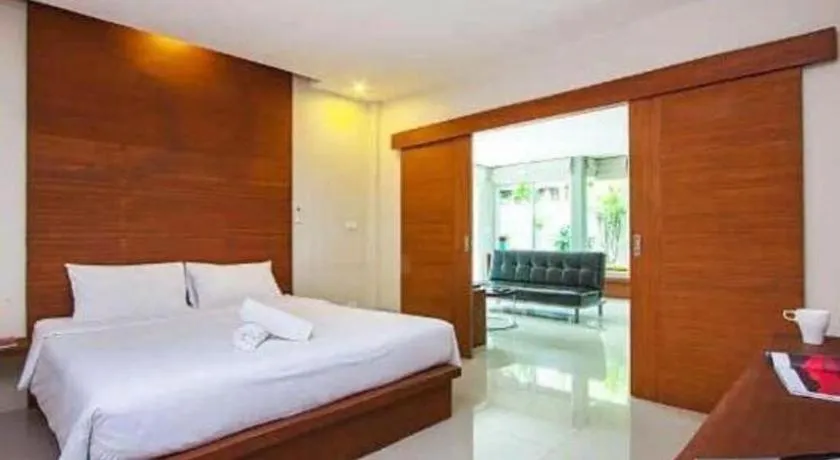 Bed in The Living Pool Villas