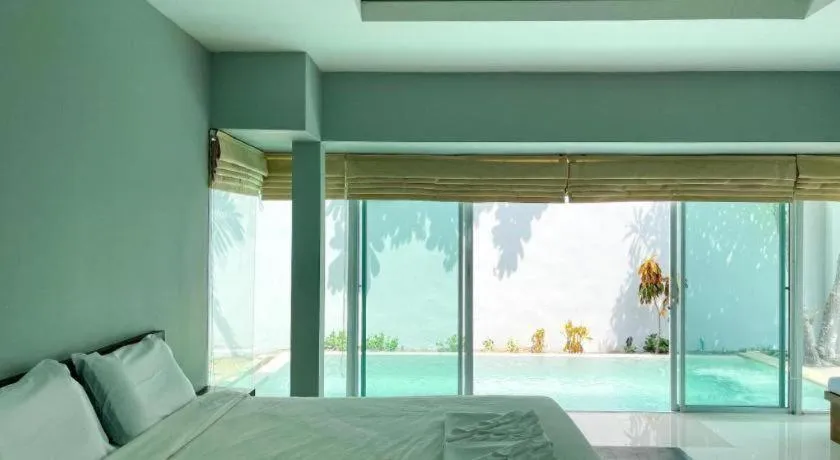 Bed in The Living Pool Villas