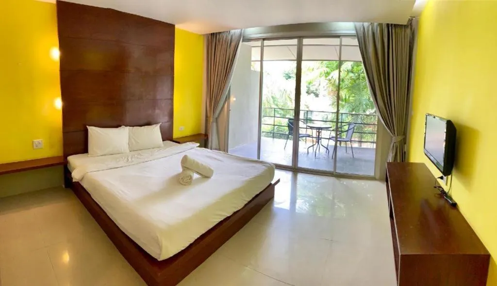 Bed in The Living Pool Villas