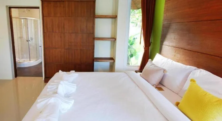 Bed in The Living Pool Villas