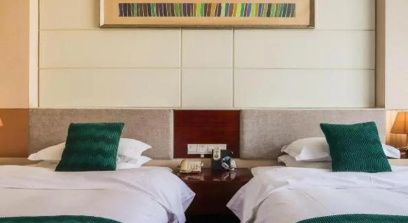 Bed in Fortune Hotel Longyan