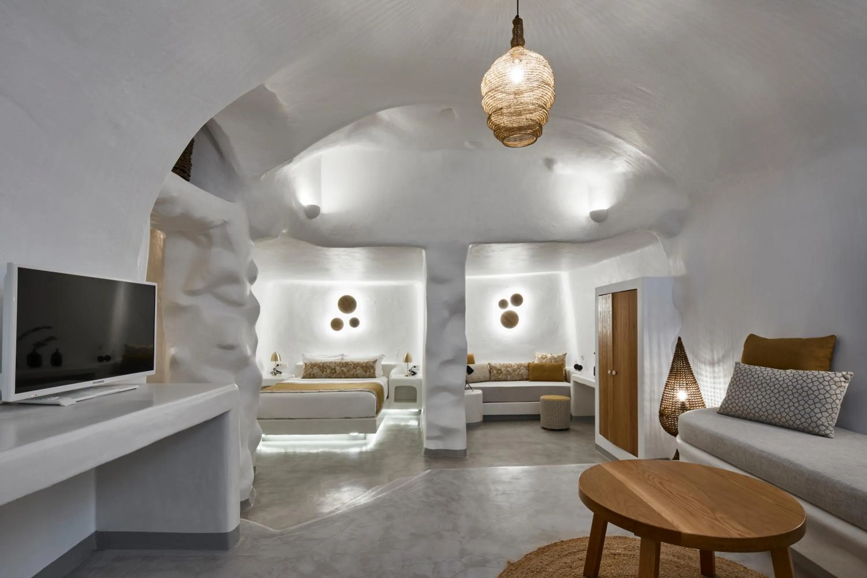 Seating area, Bed in Filotera Suites