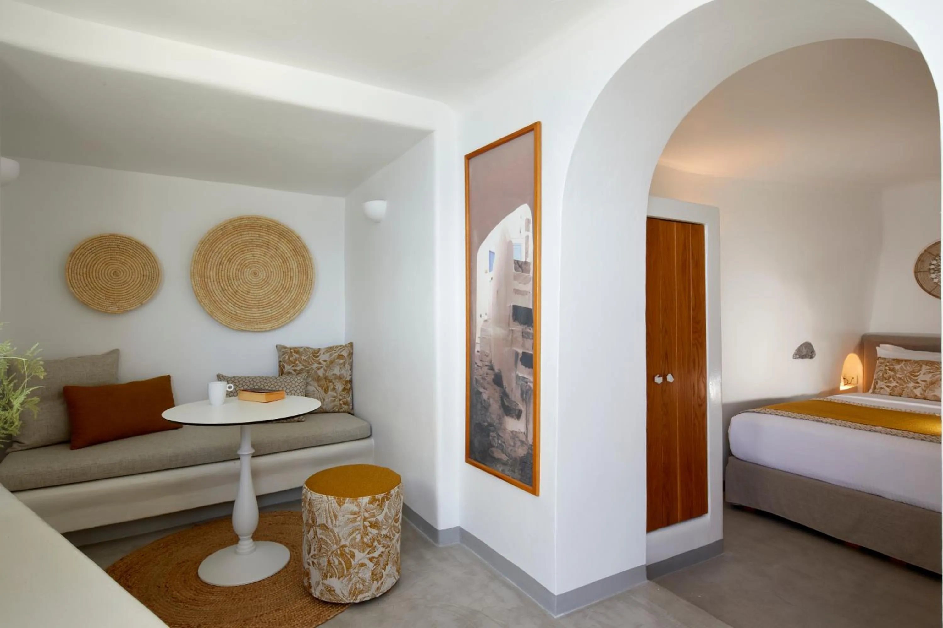 Seating area, Bed in Filotera Suites
