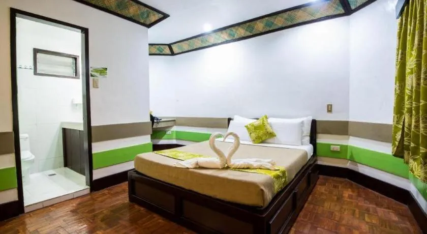 Bed in Family Country Hotel and Convention Centre