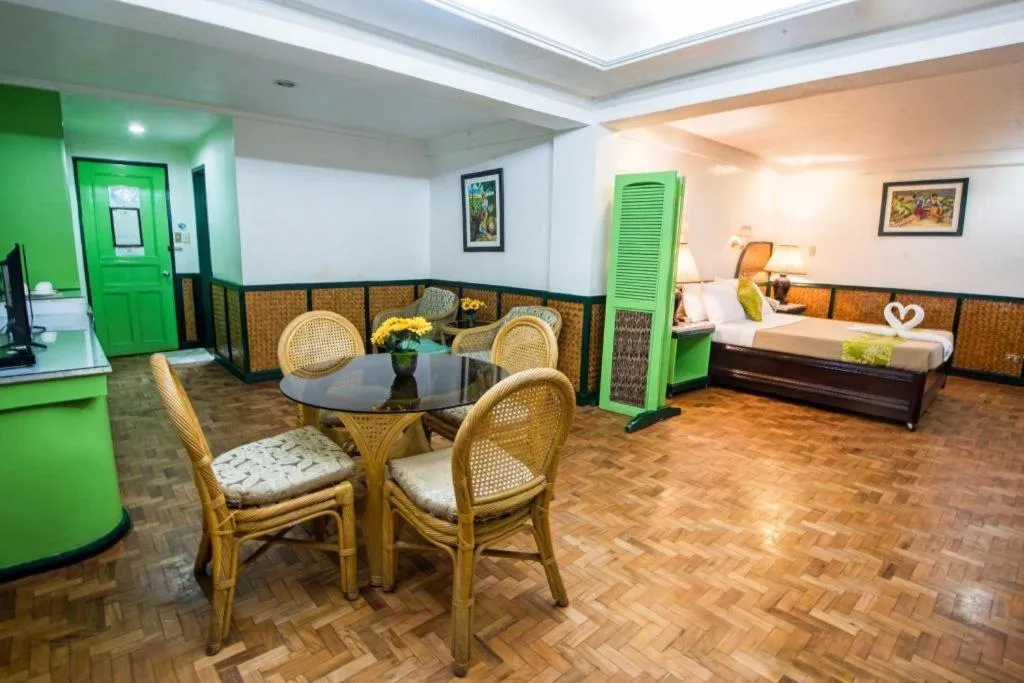 Bed in Family Country Hotel and Convention Centre