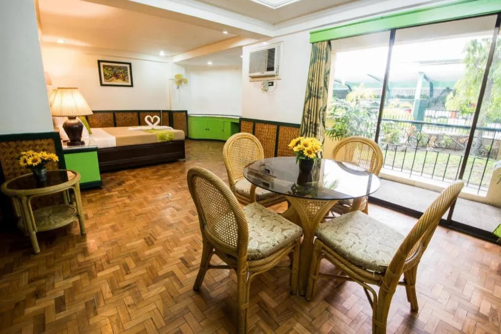 Bed in Family Country Hotel and Convention Centre