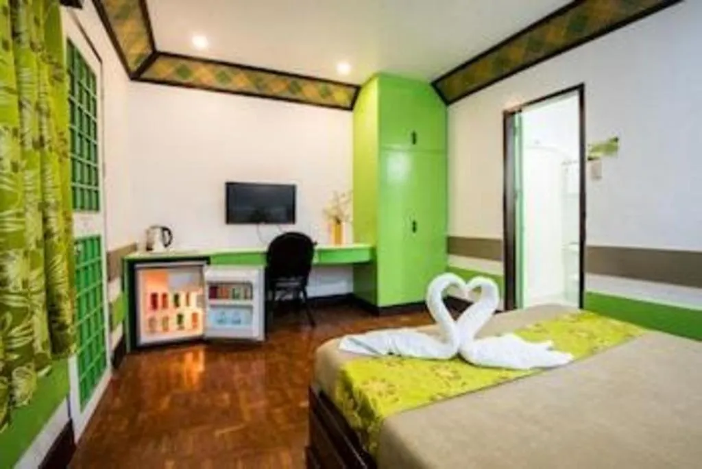 Bed in Family Country Hotel and Convention Centre