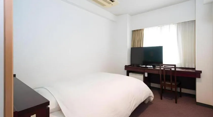 Bed in Oita Century Hotel