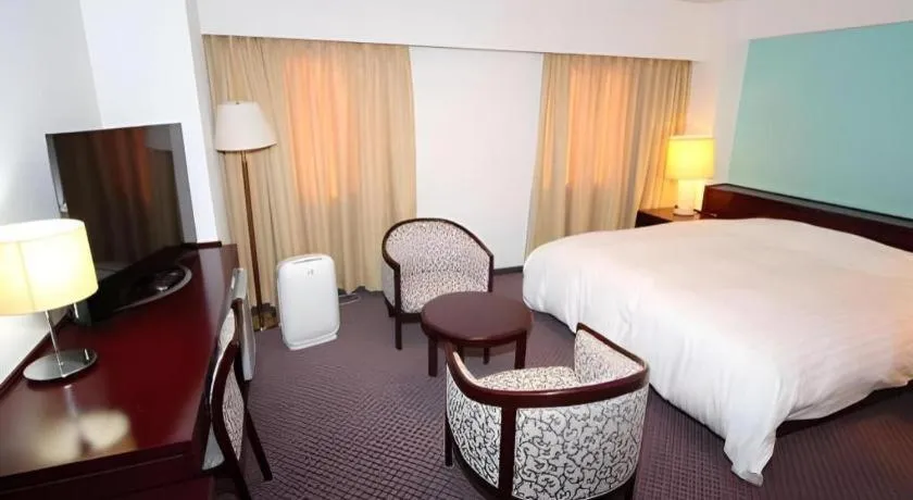 Bed in Oita Century Hotel