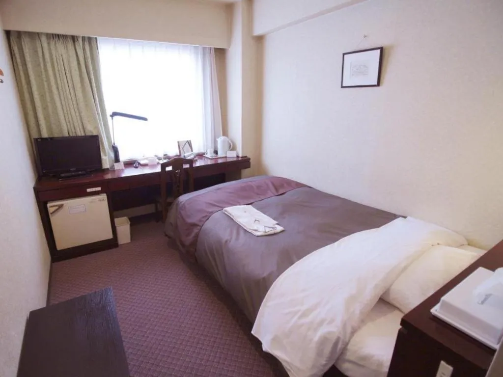Bed in Oita Century Hotel