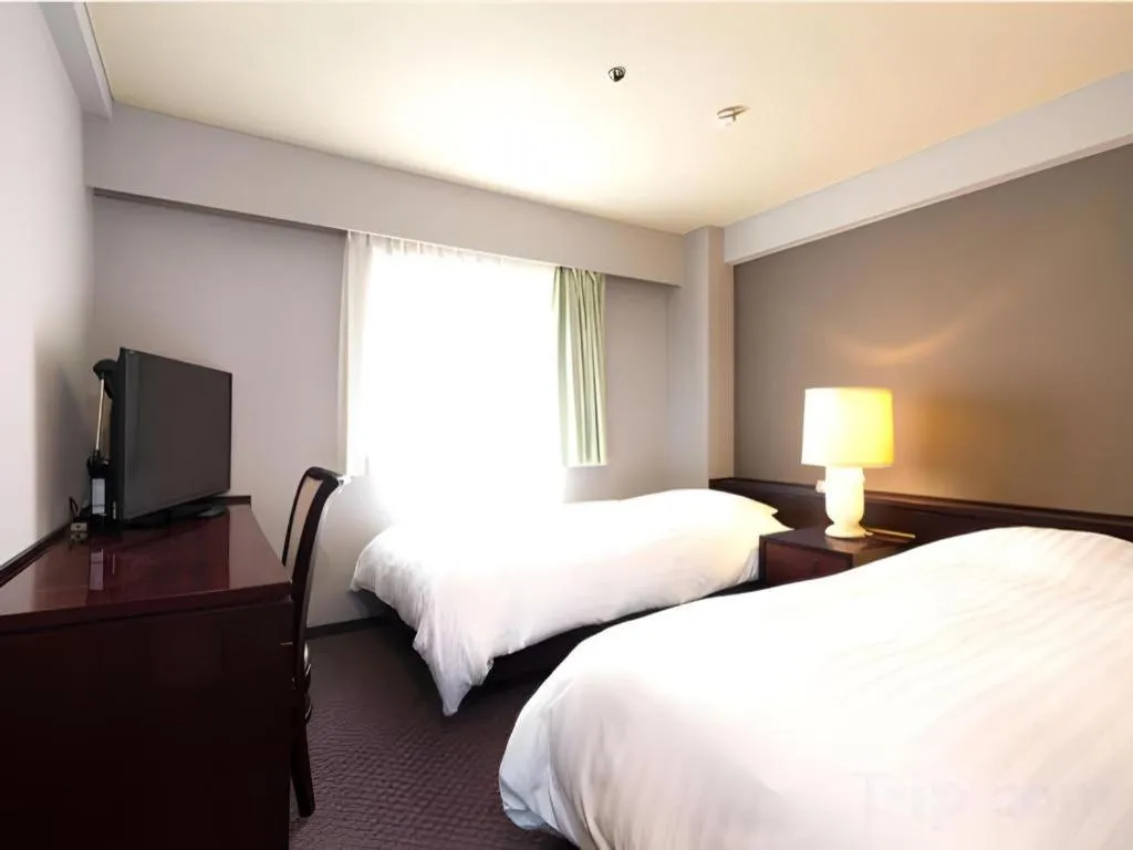 Bed in Oita Century Hotel