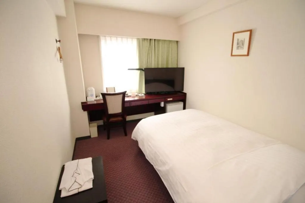 Bed in Oita Century Hotel