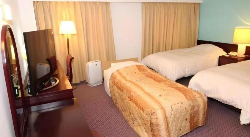 Bed in Oita Century Hotel