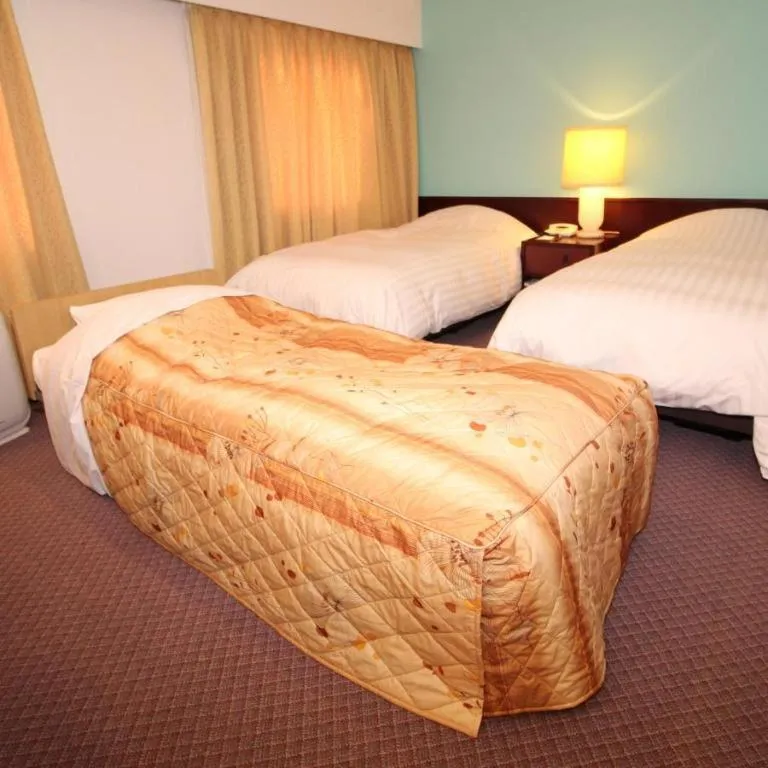 Bed in Oita Century Hotel