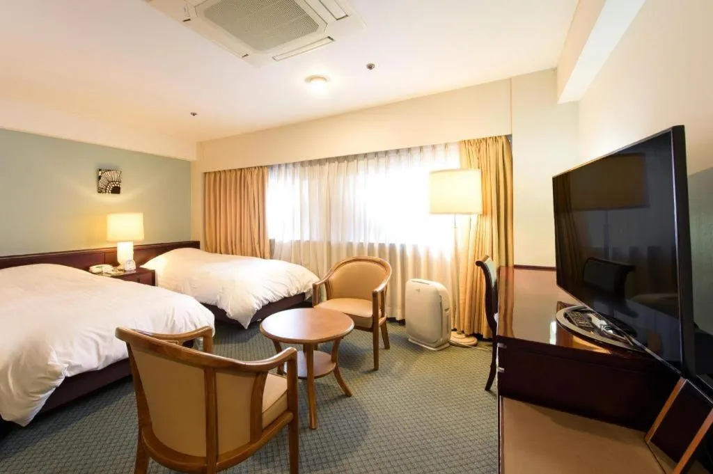Bed in Oita Century Hotel