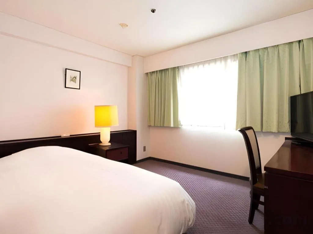 Bed in Oita Century Hotel