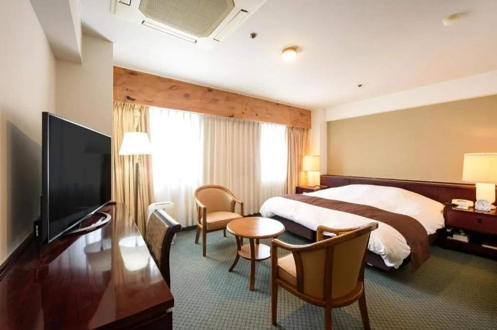 Bed in Oita Century Hotel