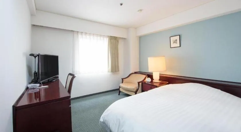 Bed in Oita Century Hotel