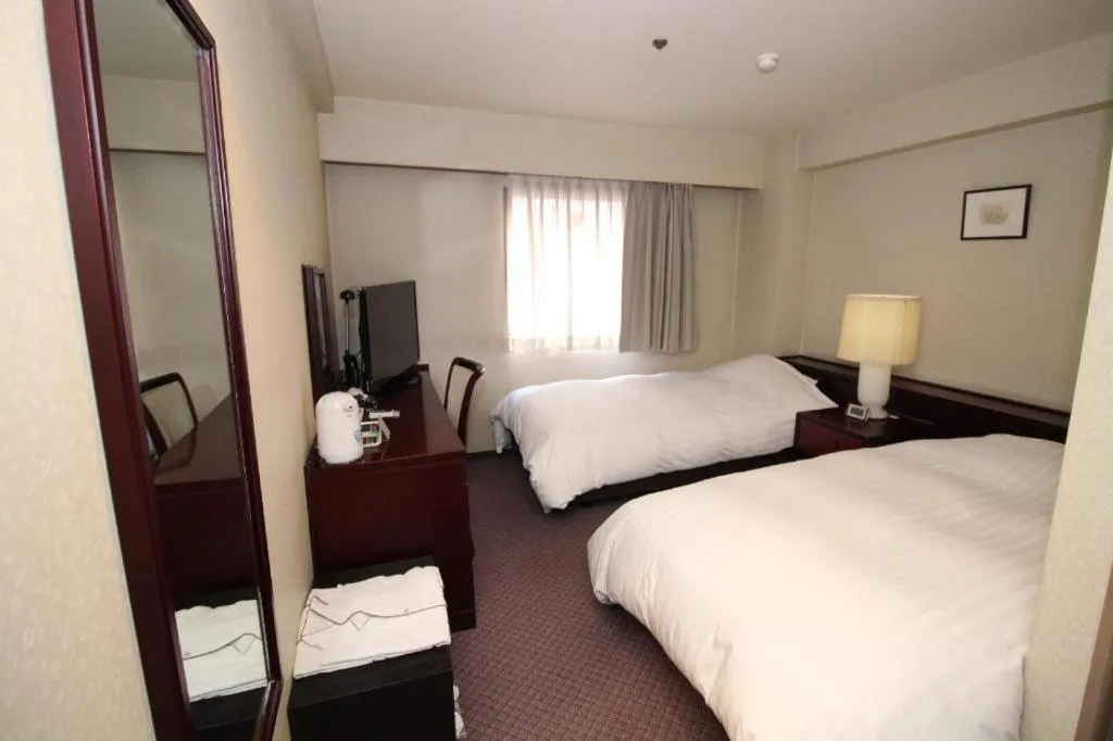 Bed in Oita Century Hotel