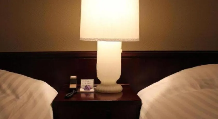 Bed in Oita Century Hotel