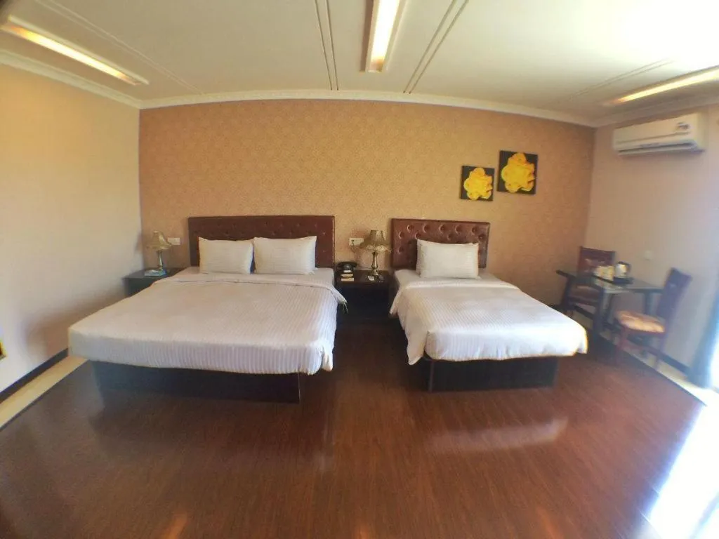 Bed in Grand Hoyah Hotel