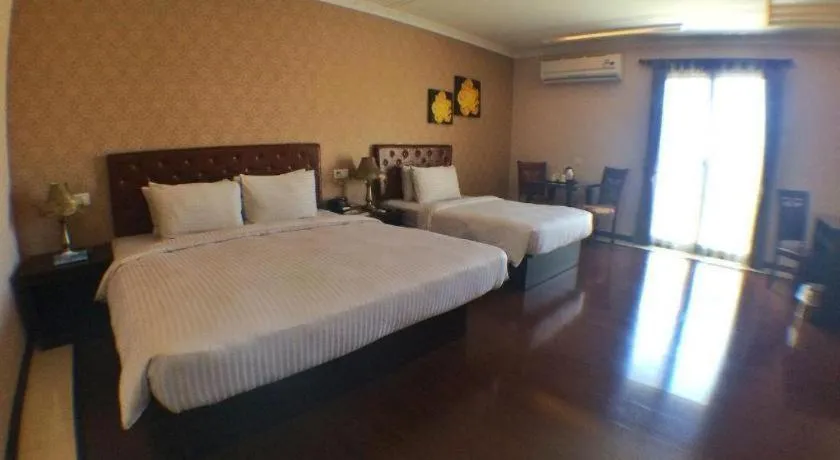 Bed in Grand Hoyah Hotel