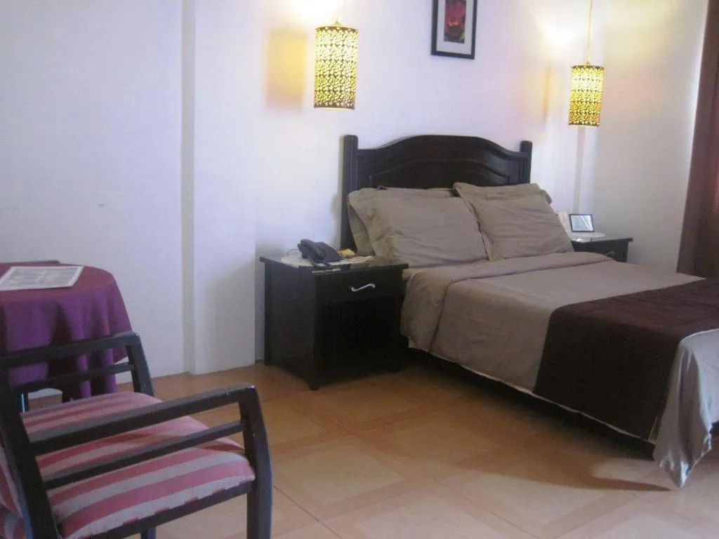 Bed in Alicia Hotel & Restaurant